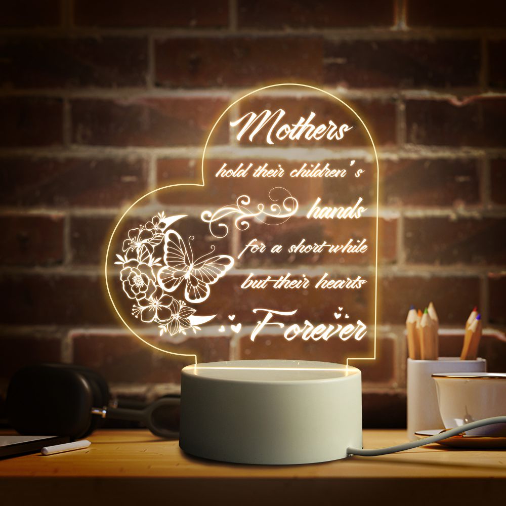 a mother's love light up sign on a table