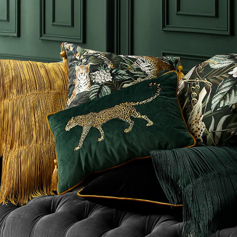 Green velvet sofa cushion showcasing golden leopard pattern