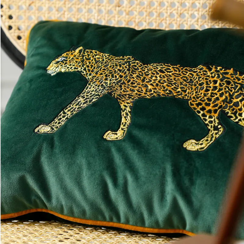 Green velvet sofa cushion showcasing golden leopard pattern