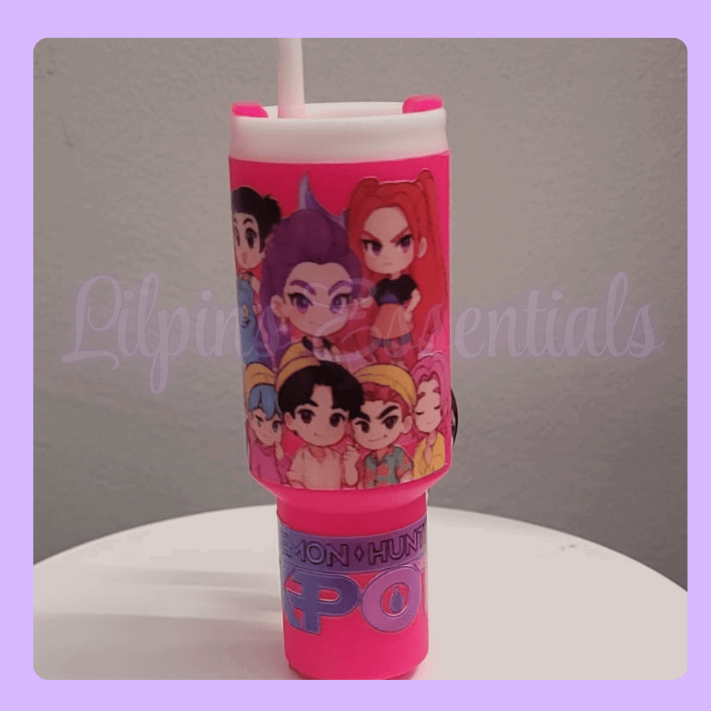 Pink stanley tumbler keychain with character design 