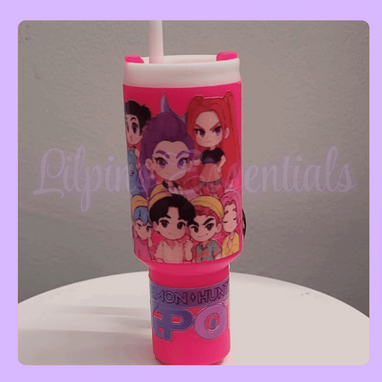 Pink stanley tumbler keychain with character design 