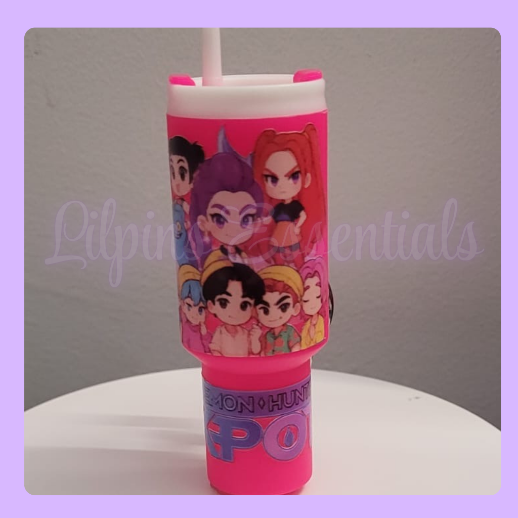 Pink stanley tumbler keychain with character design 
