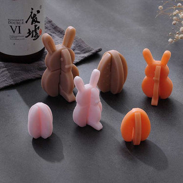 a group of small toy bunnies sitting on top of a table