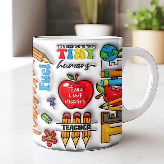 Mug with colourful teacher-themed design on a white surface
