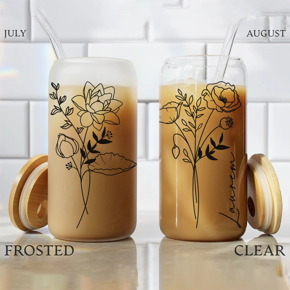 Two tumblers with floral designs, one frosted and one clear, on a white background.