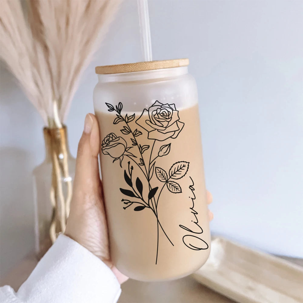 Glass tumbler with floral design and &
