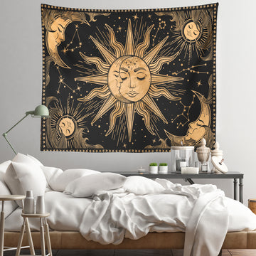 a sun and moon tapestry hanging on a wall