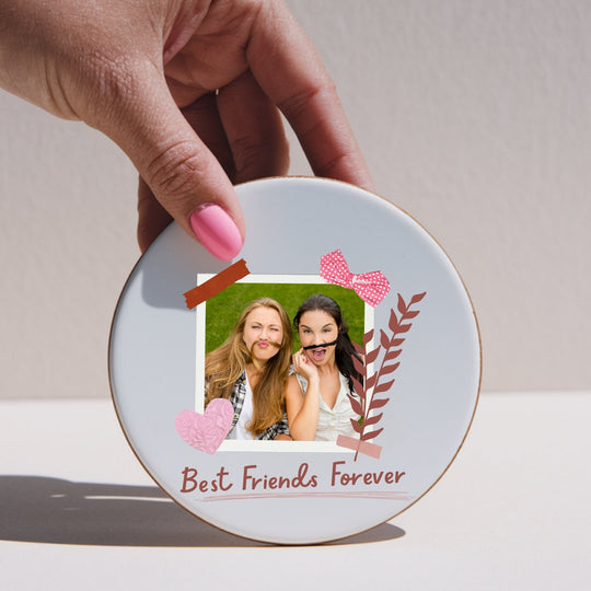 Round personalised Best Friends Forever photo coaster held by hand