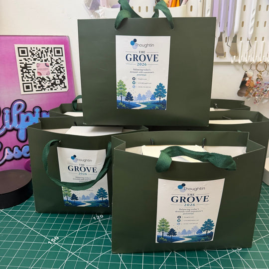 Personalised branded gift bags with handles printed with a custom business logo