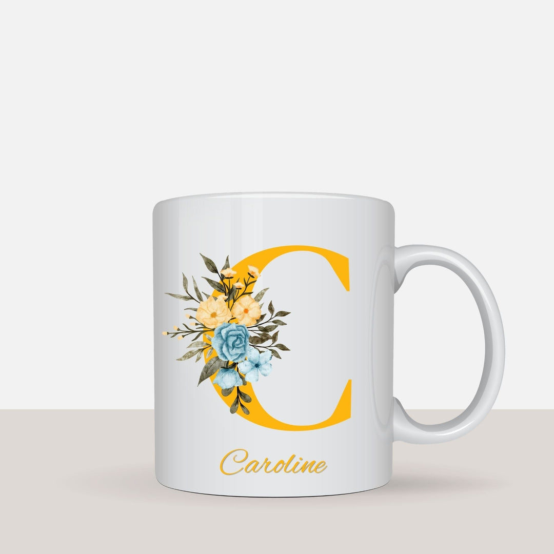 Personalised floral name mug shown in a styled lifestyle setting