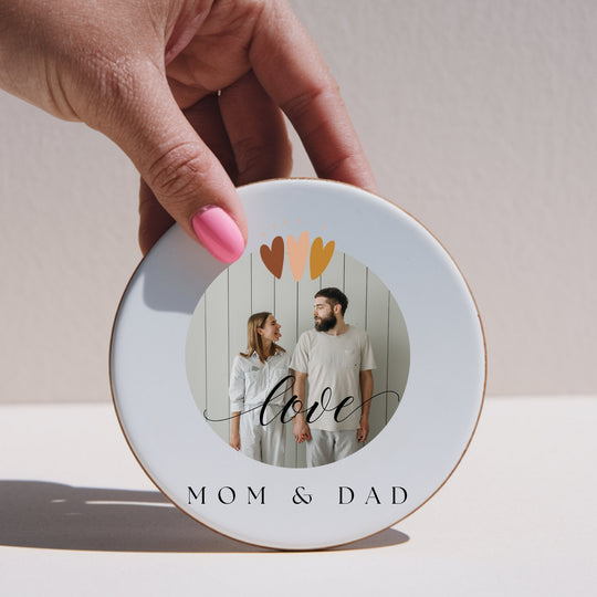 Round personalised photo coaster showing printed MDF front and cork backing