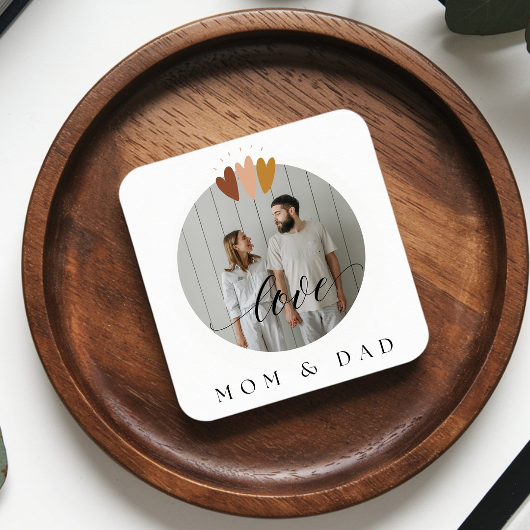Square personalised photo coaster showing printed MDF surface and cork backing