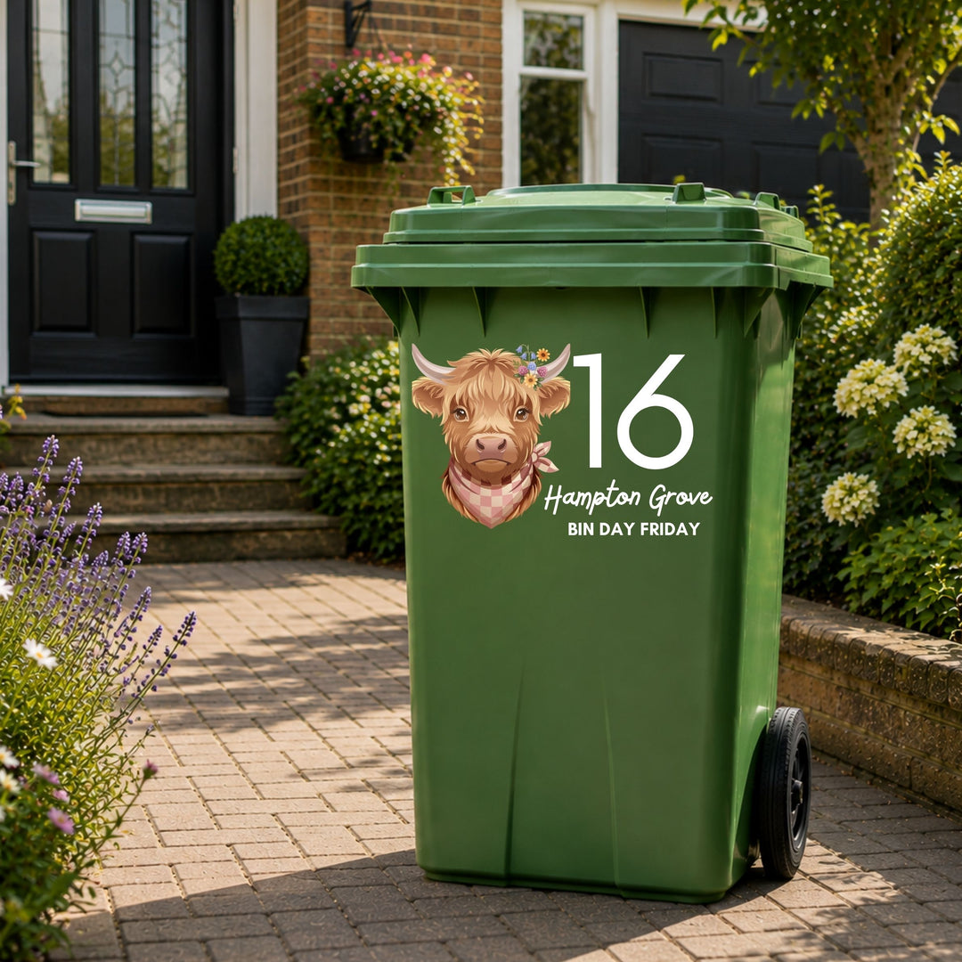 Personalised Highland Cow wheelie bin sticker with house number and street name on a green wheelie bin